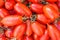 Red tomatoes background. top view
