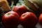 Red tomatoes display with multiple vegetables for health and diet background.