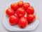 Red tomatoes fruit tomato vegetable tomat timatar pomidor tomate in a plate closeup view image photo