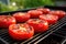 red tomatoes on a grill, close-up, featuring heat waves