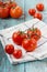 Red tomatoes on a linen napkin