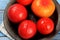 Red tomatoes are prepared for blanching