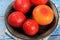 Red tomatoes are prepared for blanching