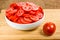 Red tomatoes sliced in a bowl