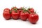 Red tomatoes on a twig on a white background