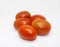 Red tomatoes on white background. Bunch of ripe vegetables for salad or soup.