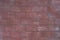 Red toned brick wall texture background. Beautiful dusty concrete blocks