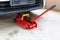 Red tool jack lift car for repair check Maintenance