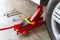 Red tool jack lift car for repair check Maintenance