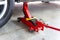 Red tool jack lift car for repair check Maintenance