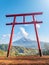 Red torii of Chureito temple with Mountain Fuji as background