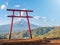 Red torii of Chureito temple with Mountain Fuji as background