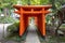 Red torii gates at Kasuga jinja shinto shrine, Kanazawa, Japan. TRANSLATION: donated