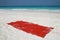 Red towel on beatiful beach