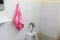 Red towel for wipe hand in toliet room on wall