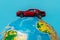 Red toy car on a globe. Travel, tourism concept