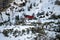 Red tracked snowmobile detail climbing fanes mountain in dolomites on white snow