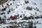 Red tracked snowmobile detail climbing fanes mountain in dolomites on white snow