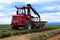 red tractor harvesting lavender in provence, france