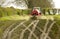 Red tractor spreading spreading slurry on fields