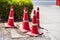 Red traffic cone on road in garden. Orange funnel use for beware car on the road in park