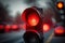 red traffic light with blurred background, symbolizing danger and urgency