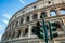 A red traffic light in front of the Colosseum, Rome