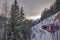 Red train in the snow in swiss alps