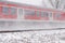 Red train with snow in winter