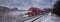 Red train speeding in the snow