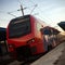 Red train vehicle on railroad station