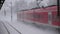 Red train in winter going in slow motion