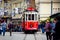 Red tram on Taksim square. Famous touristic line with vintage tram