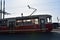 Red tramway on Troitsky bridge in Saint-Petersburg, Russia