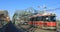 Red transit vehicle on the Queen Street Bridge in Toronto 4K