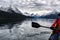 Red traveler canoeing and rocky mountain in Maligne lake