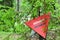 Red triangle mine warning sign in the forest