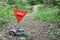 Red triangle mine warning sign in the forest