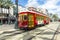 Red trolley streetcar on rail