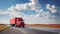 Red truck on blurry asphalt road over blue cloudy sky