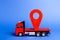 Red truck carries a red pointer location. Services transportation of goods and products, logistics and infrastructure.