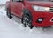Red truck in the deep snow at the off road outdoor adventure
