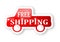 Red truck with a sign free shipping