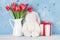 Red tulip flowers and easter rabbit toy
