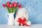 Red tulip flowers and easter rabbit toy