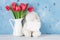 Red tulip flowers and easter rabbit toy