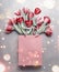 Red tulips in paper shopping bag. Festive spring flowers bunch with bokeh. Floral gift composing. Springtime holiday and greeting