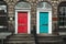 Red and turquoise doors on a facade of a house in Edinburgh