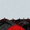 Red umbrella and many black umbrellas background with place for