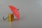 Red umbrella and the stack of coins. Keeping money safe. savings protection, Investment and capital insurance concept